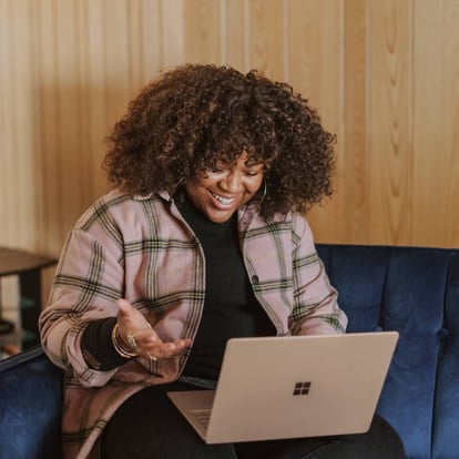Woman looking at windows laptop